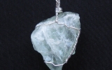 Raw aquamarine crystal pendant wire wrapped in sterling silver